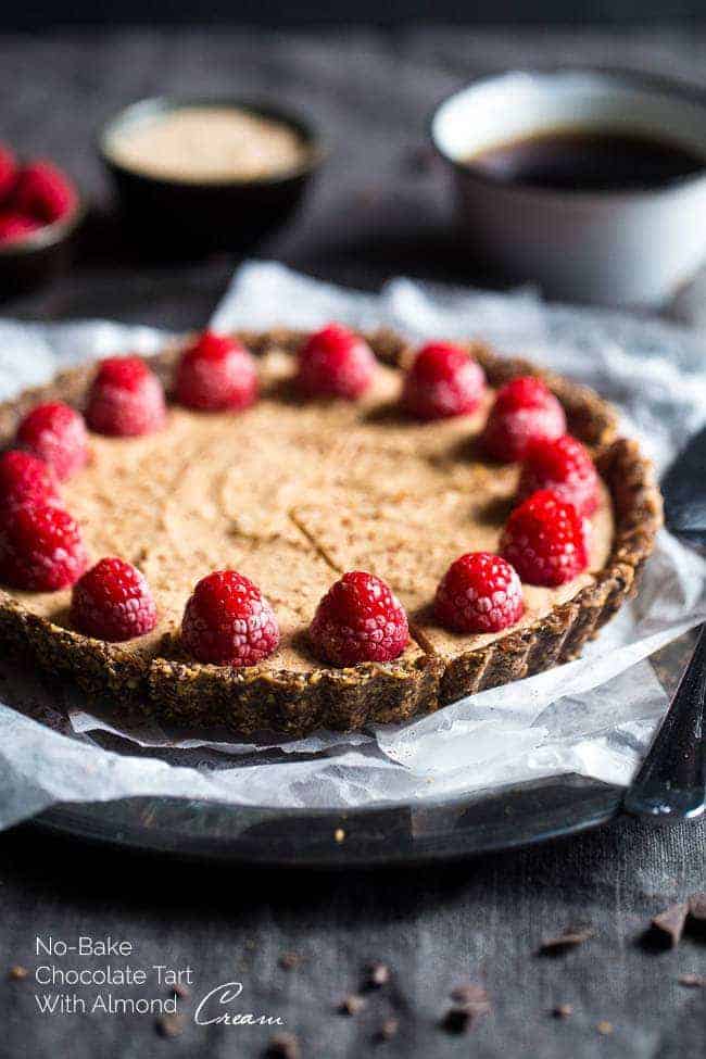 Without -baked salted chocolate cake with almond cream - this easy cake is made of almonds and data, then frozen and filled with almond cream. A healthy and gluten -free dessert that can be made in advance! | Foodfaithfitlness.com | @Foodfaithfit