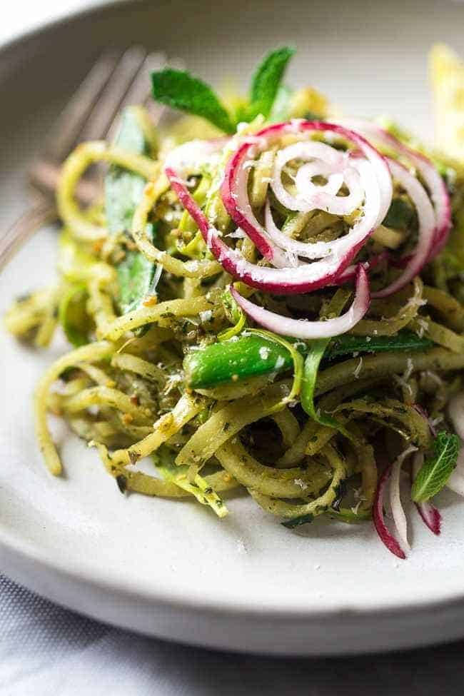 Turnip Noodle Pesto Pasta Salad with Peas and Asparagus – Spiralized turnips, asparagus and peas are tossed with pesto for a light, healthy and easy Spring meal! Low carb, gluten free and Vegetarian! | Foodfaithfitness.com | @FoodFaithFit