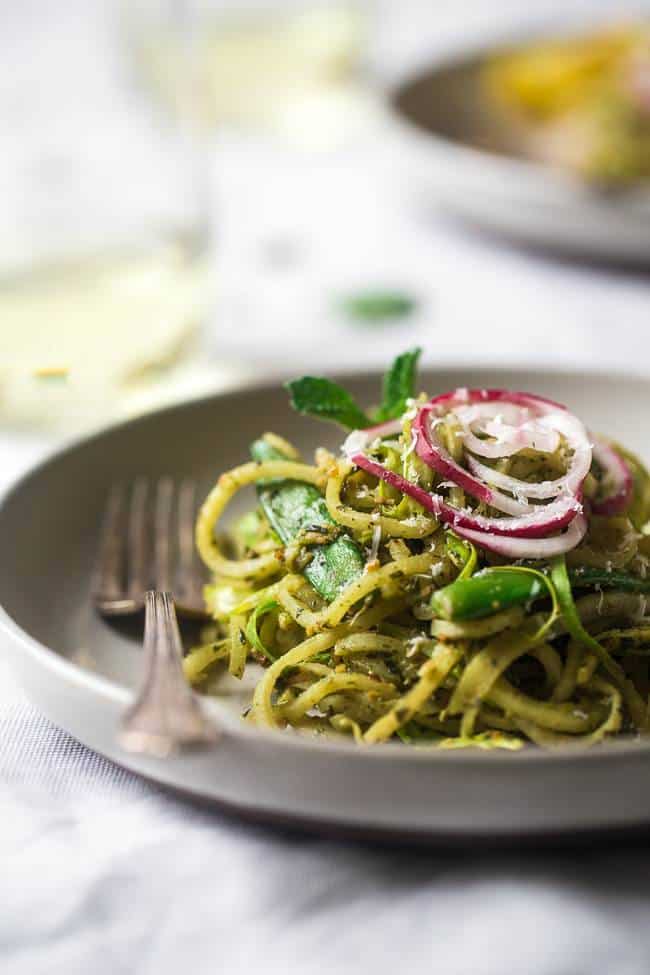 Turnip Noodle Pesto Pasta Salad with Peas and Asparagus – Spiralized turnips, asparagus and peas are tossed with pesto for a light, healthy and easy Spring meal! Low carb, gluten free and Vegetarian! | Foodfaithfitness.com | @FoodFaithFit