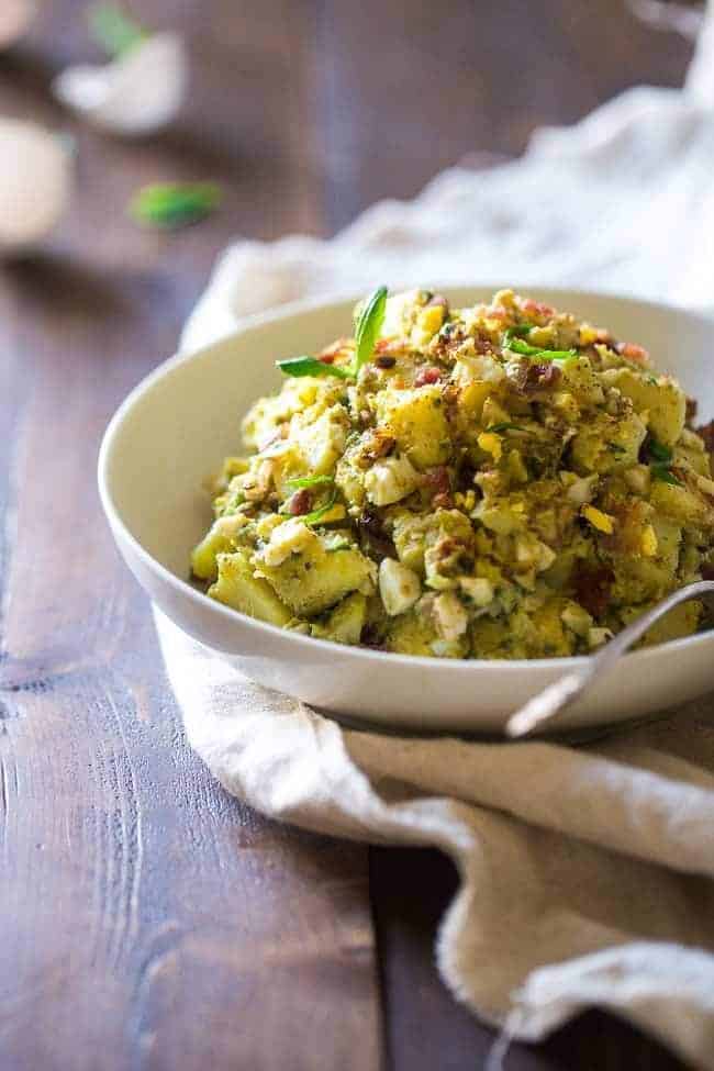 Paleo Sweet Potato Salad with Bacon, Eggs and Avocado Pesto – A healthy side dish that is SUPER creamy, easy to make and always a crowd pleaser! You won’t even miss the mayonnaise! | Foodfaithfitness.com | @FoodFaithFit