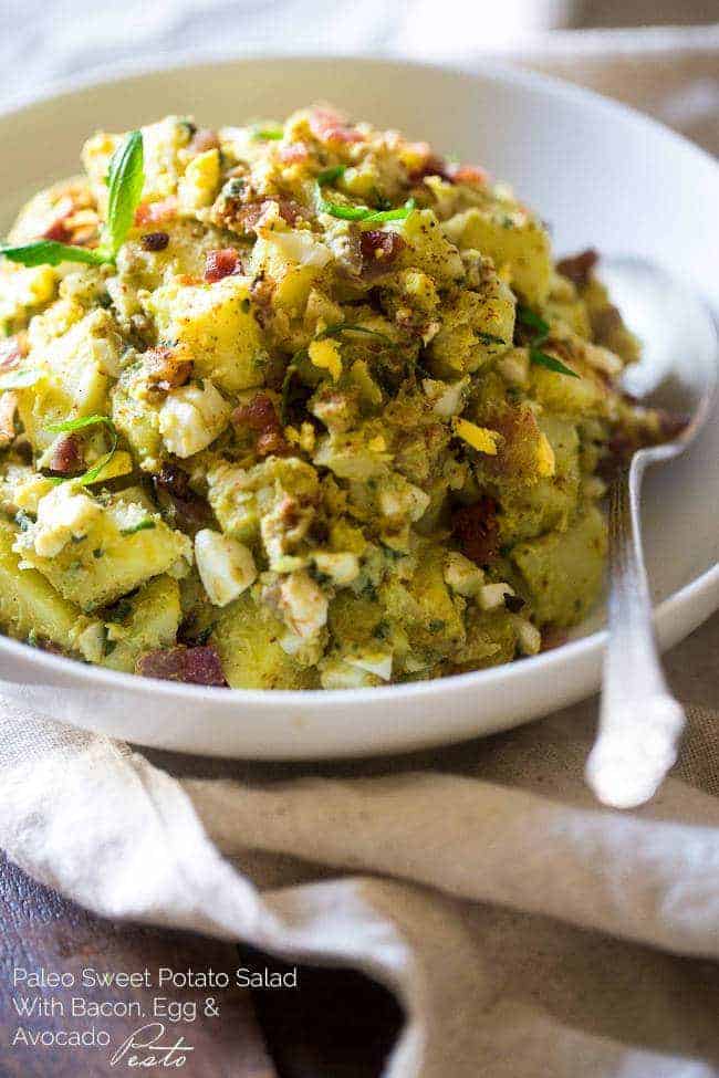 Paleo Sweet Potato Salad with Bacon, Eggs and Avocado Pesto – A healthy side dish that is SUPER creamy, easy to make and always a crowd pleaser! You won’t even miss the mayonnaise! | Foodfaithfitness.com | @FoodFaithFit