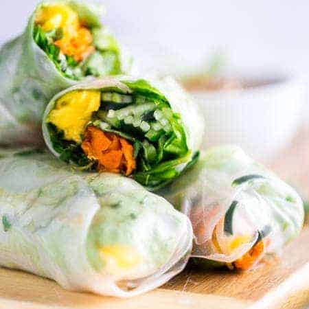 Vegan Spiralized Cucumber Noodles Mango Summer Rolls with Almond Coconut Dip - These summer rolls are made with mango and cucumber noodles, instead of rice noodles, to make them lower carb. Serve them with almond butter and coconut dip for a light and healthy, raw meal! | Foodfaithfitness.com | @FoodFaithFit