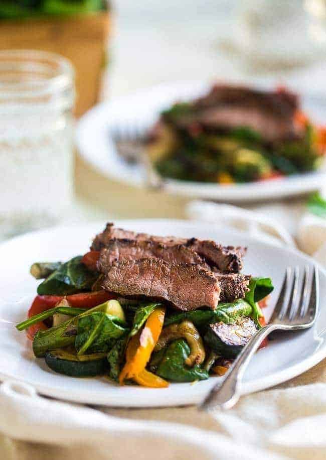 Paleo grilled beef with Asian almond dressing- beef and vegetarians are grilled and then thrown cream Asian almond butter vinaigrette and spinach for fast and easy and healthy, paleo friendly food! | Foodfaithfitlness.com | @Foodfaithfit