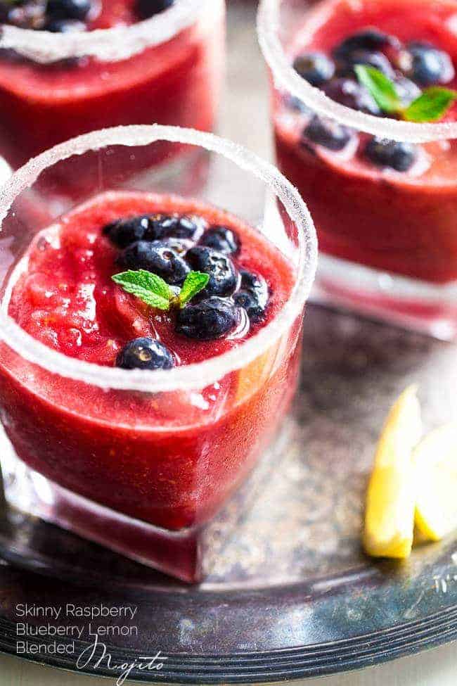Skinny Blended Lemon Raspberry Mojito with Muddled Blueberries - Thick, frosty and SO refreshing for only 115 calories! Skinny summer drinking at it's best! | Foodfaithfitness.com | @FoodFaithFit