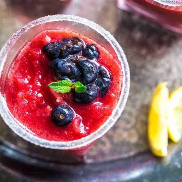 Skinny Blended Lemon Raspberry Mojito with Muddled Blueberries - Thick, frosty and SO refreshing for only 115 calories! Skinny summer drinking at it's best! | Foodfaithfitness.com | @FoodFaithFit