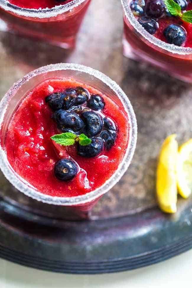 Skinny Blended Lemon Raspberry Mojito with Muddled Blueberries - Thick, frosty and SO refreshing for only 115 calories! Skinny summer drinking at it's best! | Foodfaithfitness.com | @FoodFaithFit