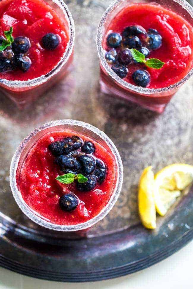 Skinny Blended Lemon Raspberry Mojito with Muddled Blueberries - Thick, frosty and SO refreshing for only 115 calories! Skinny summer drinking at it's best! | Foodfaithfitness.com | @FoodFaithFit