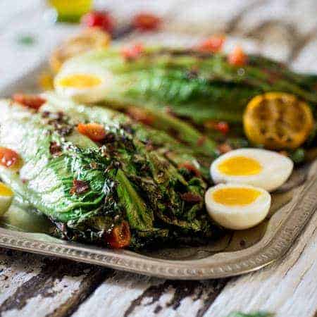BLT grilled wedge salads with lemon dill vinaigrette - grilled Romaine hearts are thrown by turkey bacon, tomatoes, soft boiled eggs and creamy, homemade lemon dill dressing! It is low carbohydrates, healthy summer meal for 300 calories! | Foodfaithfitlness.com | @Foodfaithfit