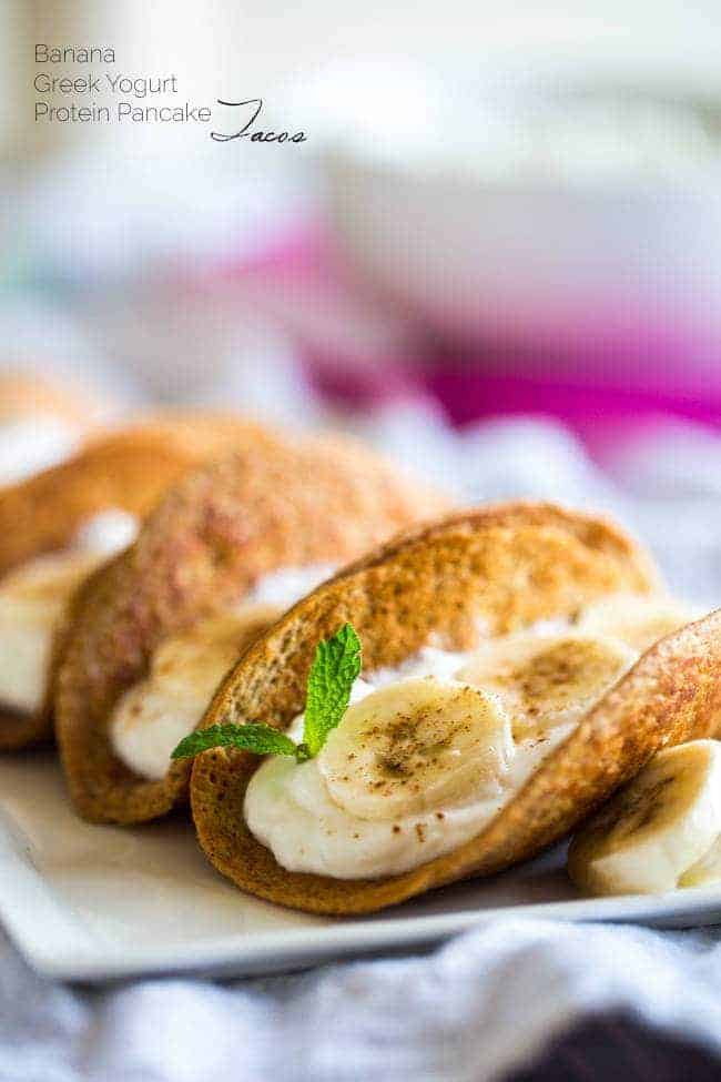 Greek Yogurt Banana Pancake Tacos - These gluten free banana pancakes are filled with Greek yogurt and rolled up like tacos! They're a fun, healthy breakfast for only 100 calories per taco! | Foodfaithfitness.com | @FoodFaithFit