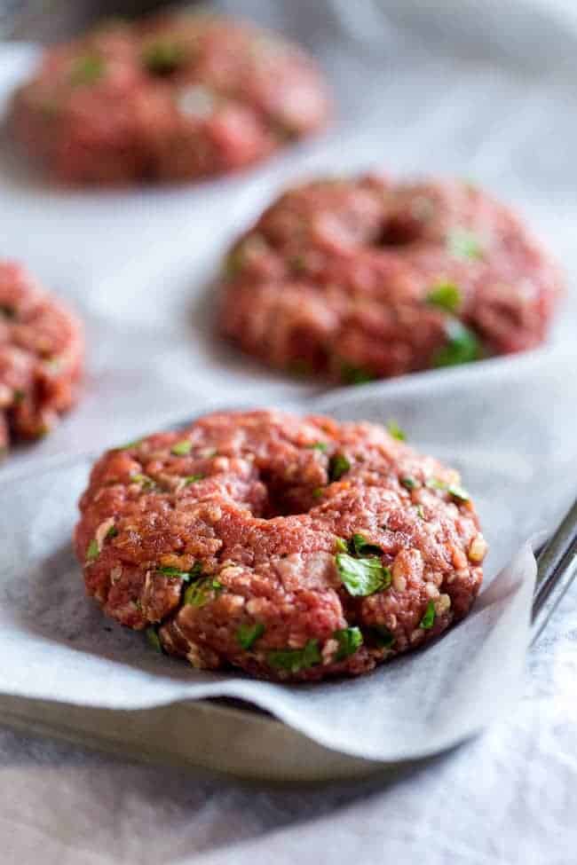 Paleo Burgers with Grilled Pineapple and Curry Cashew Cream - Topped with smooth and spicy curry cashew cream, grilled pineapple and wrapped with lettuce, this burger is a low carb, healthy meal for under 250 calories! | Foodfaithfitness.com | @FoodFaithFit