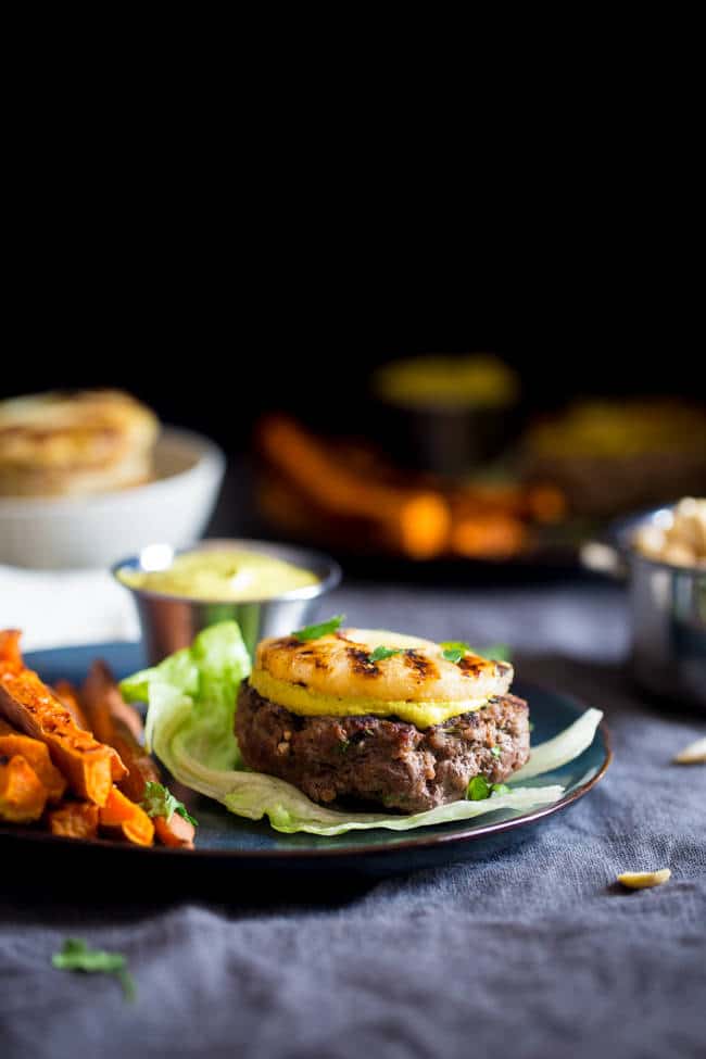 Paleo Burgers with Grilled Pineapple and Curry Cashew Cream - Topped with smooth and spicy curry cashew cream, grilled pineapple and wrapped with lettuce, this burger is a low carb, healthy meal for under 250 calories! | Foodfaithfitness.com | @FoodFaithFit