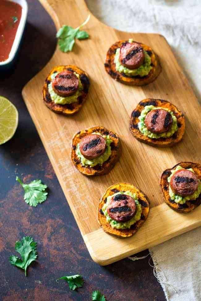 Spicy Grilled Sweet Potatoes with Avocado Salsa and Turkey Sausage - Grilled Sweet Potatoes are covered with creamy, smooth avocado salsa and turkey sausage for a quick, easy and healthy appetizer! Perfect for summer entertaining! | Foodfaithfitness.com | @FoodFaithFit