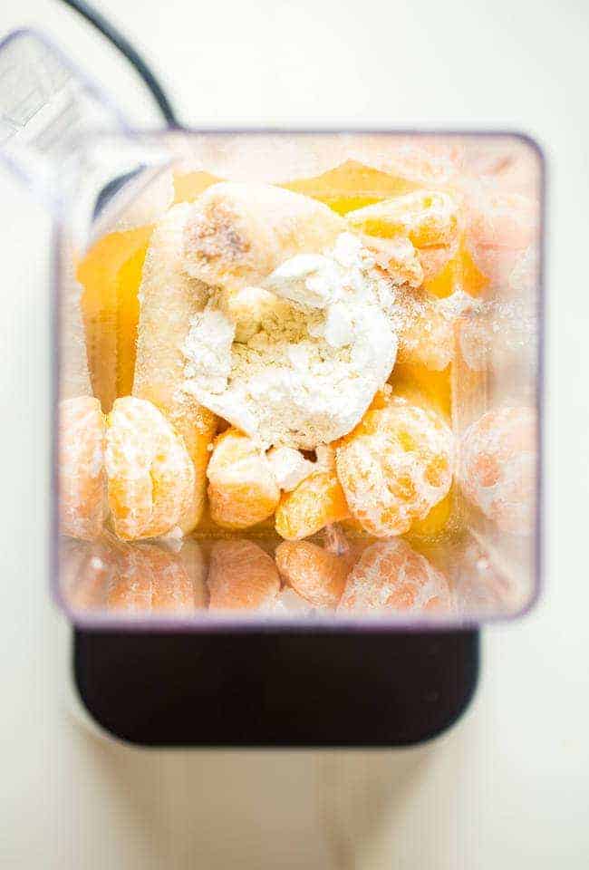 Banana Creamsicle Protein Smoothie - This orange smoothie is SO thick, creamy, and packed with vanilla protein powder so it tastes like a creamsicle! Ready in 5 minutes, loading with antioxidants and perfect for post workout recovery! | Foodfaithfitness.com | @FoodFaithFit