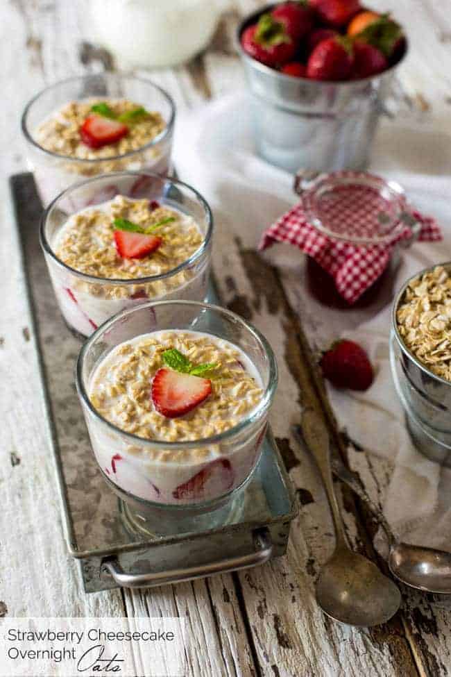 Strawberry Cheesecake Overnight Oats - These overnight oats are layered with a mixture of strawberry jam, cream cheese and Greek yogurt for a quick and easy, high-protein breakfast that feels like dessert! | Foodfaithfitness.com | @FoodFaithFit