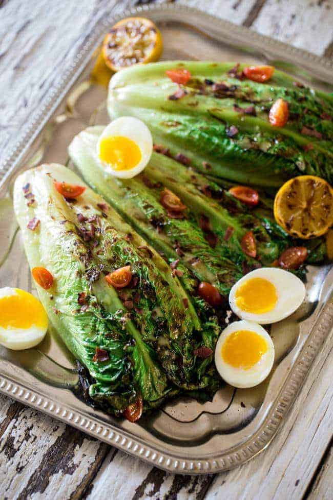 BLT Grilled Wedge Salads with Lemon Dill Vinaigrette - Grilled romaine hearts are tossed with turkey bacon, tomato, soft boiled eggs and a creamy, homemade lemon dill dressing! It's a low carb, healthy summer meal for 300 calories! | Foodfaithfitness.com | @FoodFaithFit