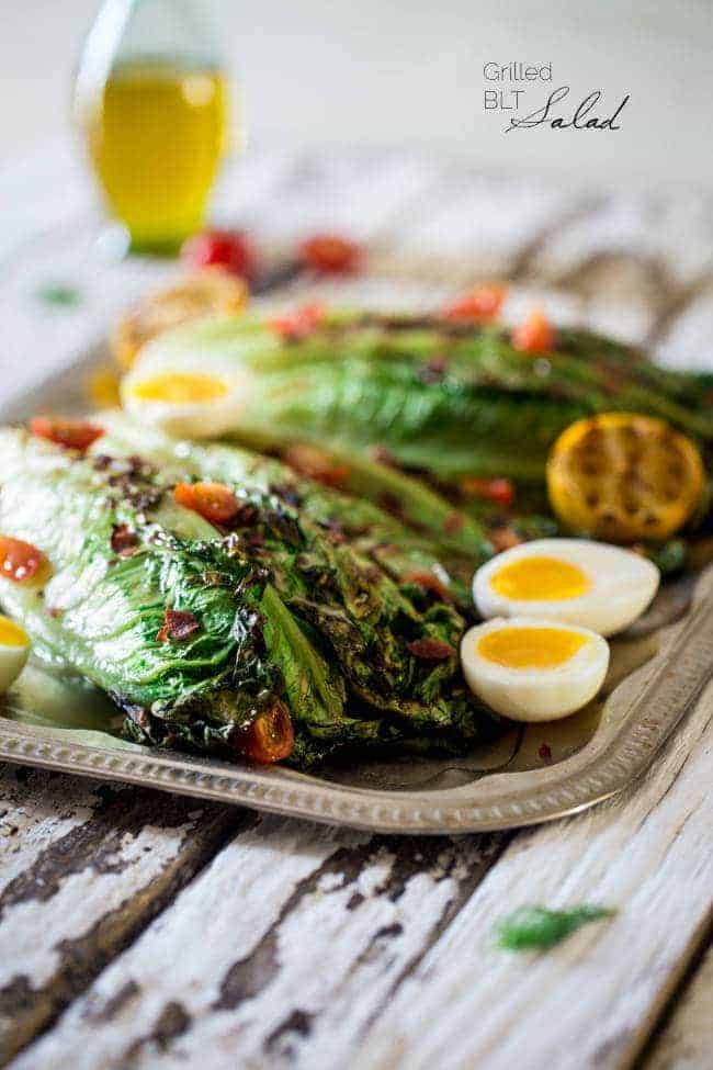 BLT Grilled Wedge Salads with Lemon Dill Vinaigrette - Grilled romaine hearts are tossed with turkey bacon, tomato, soft boiled eggs and a creamy, homemade lemon dill dressing! It's a low carb, healthy summer meal for 300 calories! | Foodfaithfitness.com | @FoodFaithFit