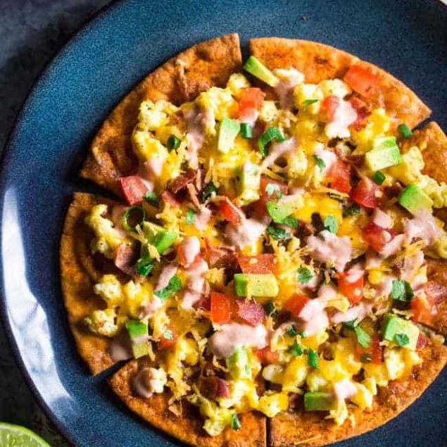 Homemade Healthy Breakfast Nachos - These spicy, healthy nachos are loaded with bacon, scrambled eggs, cheese and a Greek yogurt salsa for an easy, high protein & gluten free breakfast! | Foodfaithfitness.com | @FoodFaithFit