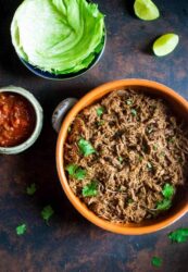 Shredded slow-cooker roast beef with cilantro, salsa, and lettuce wraps.