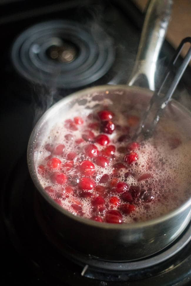 Paleo Maple Orange Cranberry Sauce - This healthy, homemade cranberry sauce uses only 3 ingredients and is Paleo friendly and refined- sugar free! It's ready in 30 minutes and is perfect for Thanksgiving! | Foodfaithfitness.com| @FoodFaithFit
