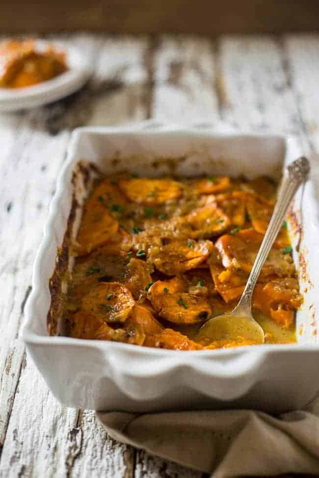 Paleo + Vegan Scalloped Sweet potatoes - These potatoes are SO creamy and flavorful, you'll have a hard time believing they're secretly healthy and paleo and vegan friendly! Perfect for Thanksgiving! | Foodfaithfitness.com | @FoodFaithFit
