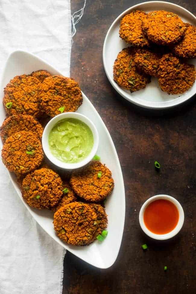 Vegan Buffalo Patties with Avocado Dip - These patties taste just like buffalo chicken, but they're totally meat free and made with cauliflower and quinoa! They're a spicy, crunchy and creamy appetizer for game day! | Foodfaithfitness.com | @FoodFaithFit