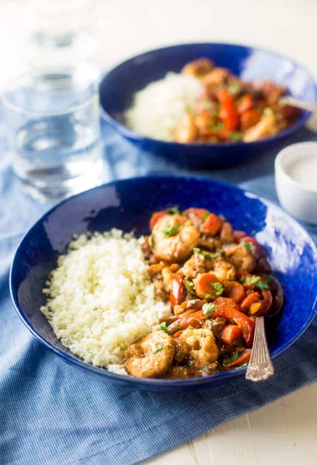 Whole 30 Jerk Shrimp Stew with Cauliflower Rice - This creamy stew uses coconut milk, pineapples and bold flavors for a healthy, 30 minute weeknight meal that is paleo friendly and whole 30 compliant! | Foodfaithfitness.com