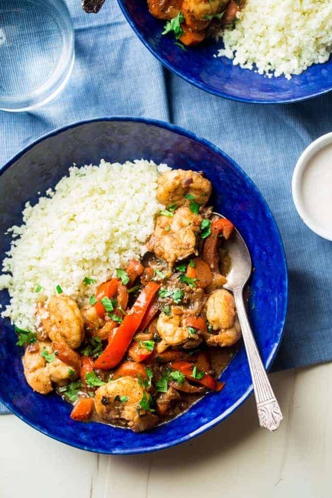Whole 30 Jerk Shrimp Stew with Cauliflower Rice - This creamy stew uses coconut milk, pineapples and bold flavors for a healthy, 30 minute weeknight meal that is paleo friendly and whole 30 compliant! | Foodfaithfitness.com