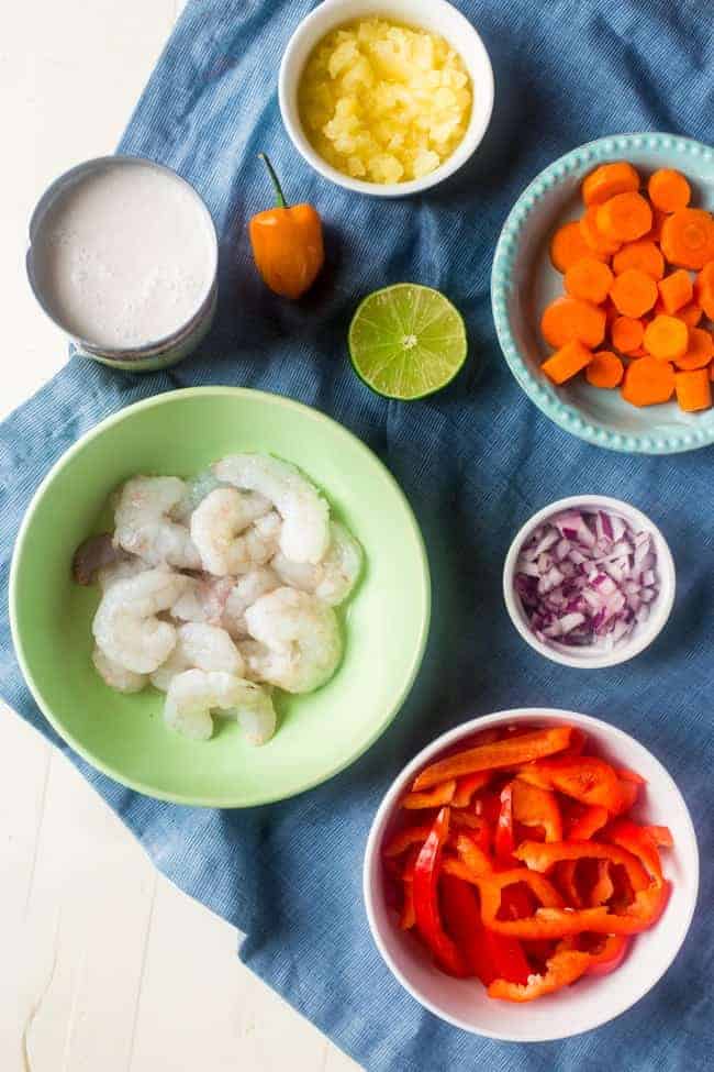Whole 30 Jerk Shrimp Stew with Cauliflower Rice - This creamy stew uses coconut milk, pineapples and bold flavors for a healthy, 30 minute weeknight meal that is paleo friendly and whole 30 compliant! | Foodfaithfitness.com