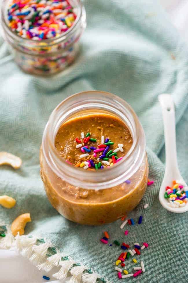 Vegan Cake Batter Macadamia Cashew Butter - This 6 ingredient vegan cake batter cashew butter is made extra delicious with macadamia nuts! It's an easy, healthy spread that tastes like funfetti cake! | Foodfaithfitness.com | @FoodFaithFit