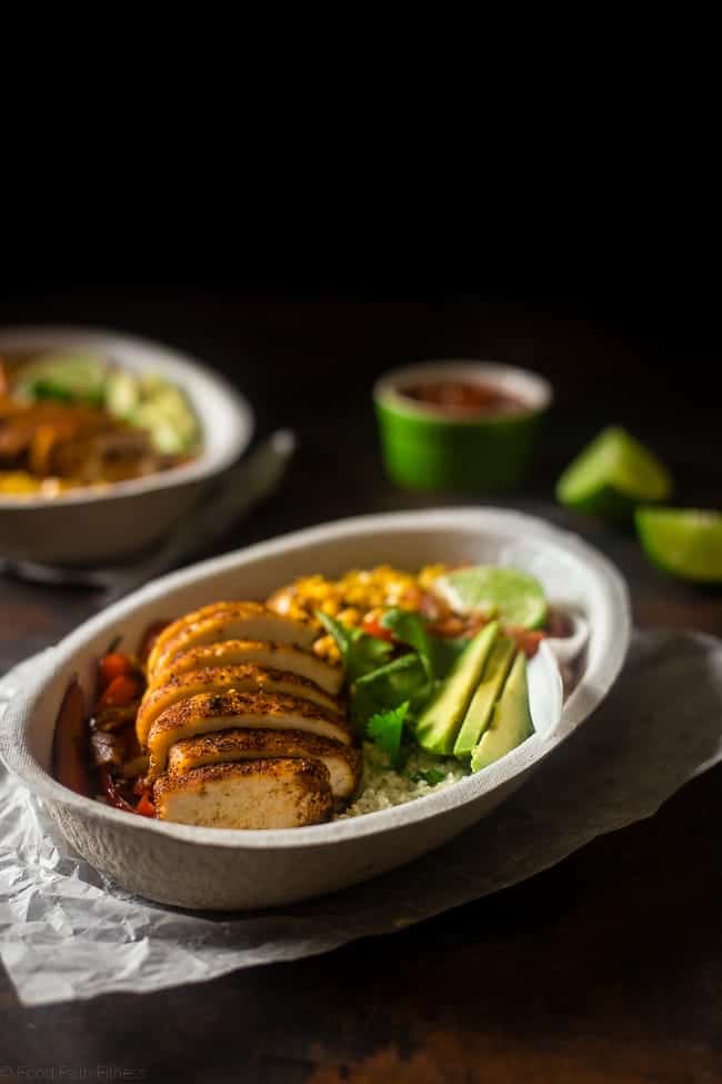 Paleo Chipotle Chicken Burrito Bowls - Make your own healthy, gluten free and paleo-friendly Chipotle Burrito Bowl at home with this quick and easy, 30 minute recipe! It's perfect for busy weeknights and under 450 calories! | Foodfaithfitness.com | @FoodFaithFit