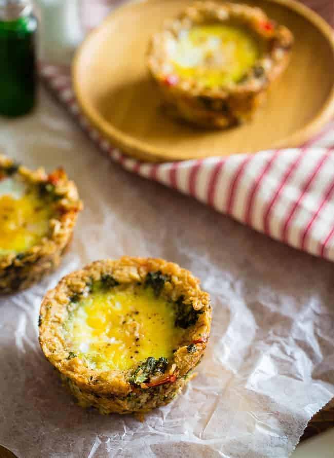 Egg Muffins with Savory Oatmeal Crust - These quick and easy egg muffins have a vegetable and savory oatmeal crust! They're a healthy and gluten free portable snack or breakfast for busy mornings, with only 80 calories and 2 SmartPoints! | Foodfaithfitness.com | @FoodFaithFit