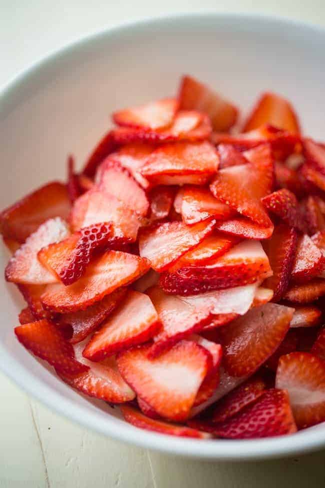 Strawberry Lemon Paleo Crepe Cake with Coconut Cream - This cake is made out of paleo crepes layered with rich, sweet lemon coconut cream and fresh strawberries. It's a gluten free dessert, that's perfect for a spring brunch or Mothers day! | Foodfaithfitness.com | @FoodFaithFit