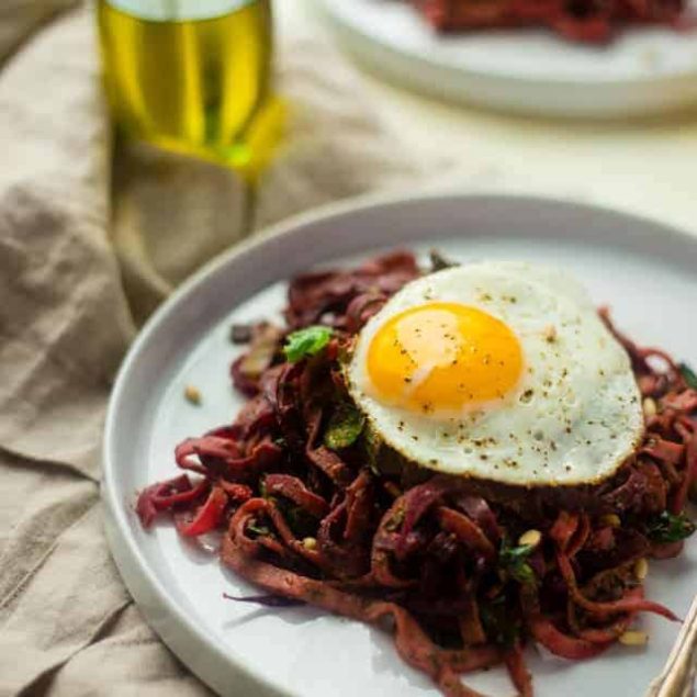 Spiralized Turnip and Beet Salad with Pesto and Fried Eggs - Turnip and beet noodles, fresh pesto and fried eggs make this whole 30 and paleo friendly recipe, that's perfect for spring and under 300 calories! | Foodfaithfitness.com | @FoodFaithFit