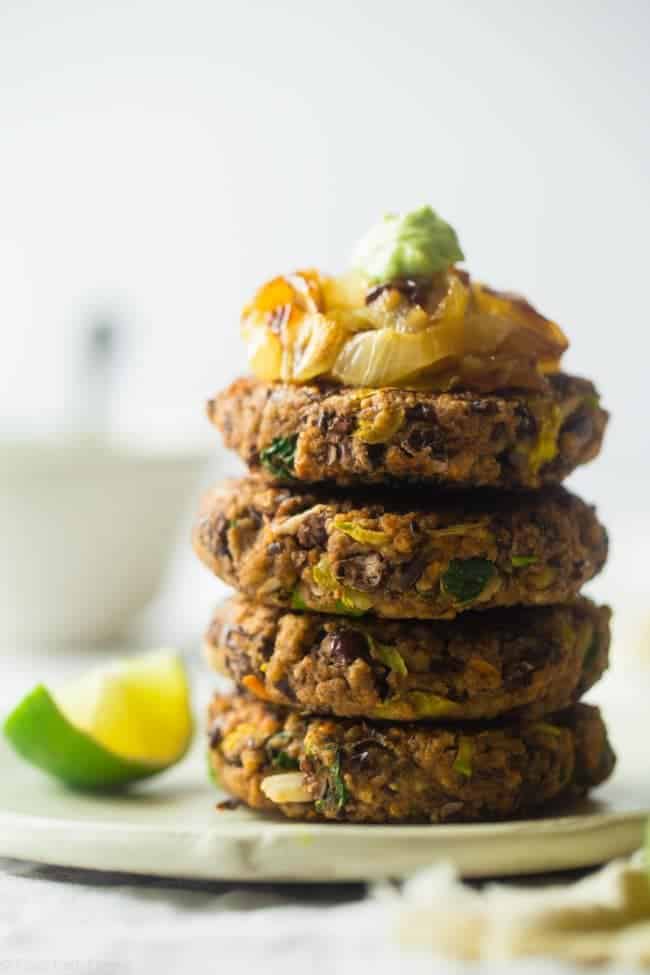 Black Bean Power Burger with Avocado Crema - This black bean burger is so tender and juicy you would never know it's meatless! Load it up with caramelized onions and avocado crema for a healthy, gluten free meal that's easy to prepare! | Foodfaithfitness.com | @FoodFaithFit