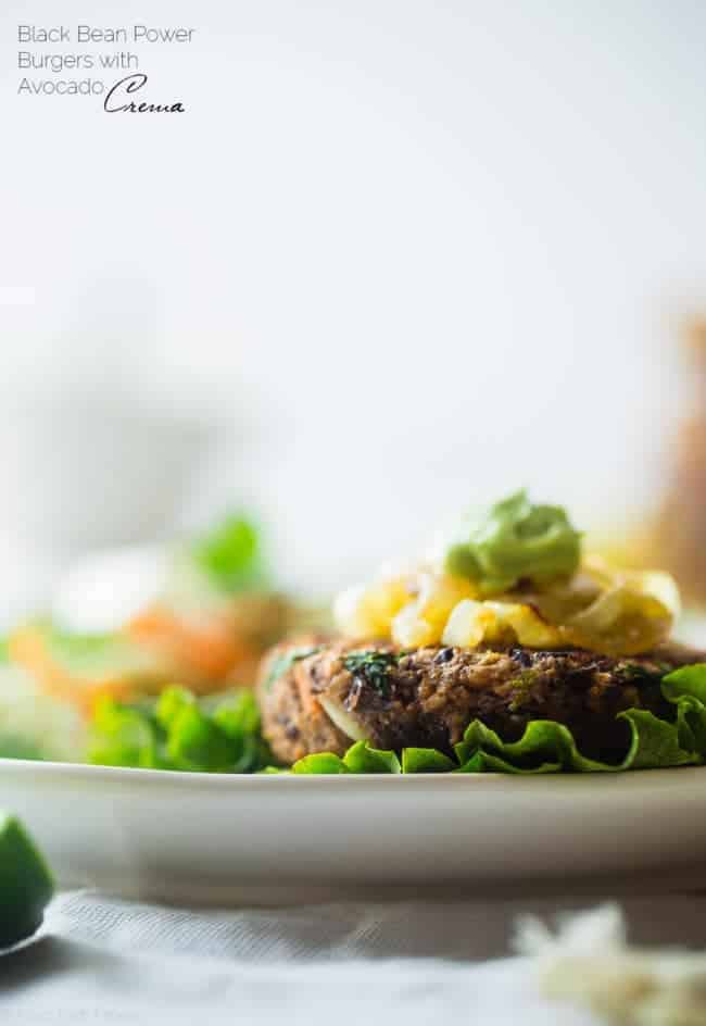 Black Bean Power Burger with Avocado Crema - This black bean burger is so tender and juicy you would never know it's meatless! Load it up with caramelized onions and avocado crema for a healthy, gluten free meal that's easy to prepare! | Foodfaithfitness.com | @FoodFaithFit