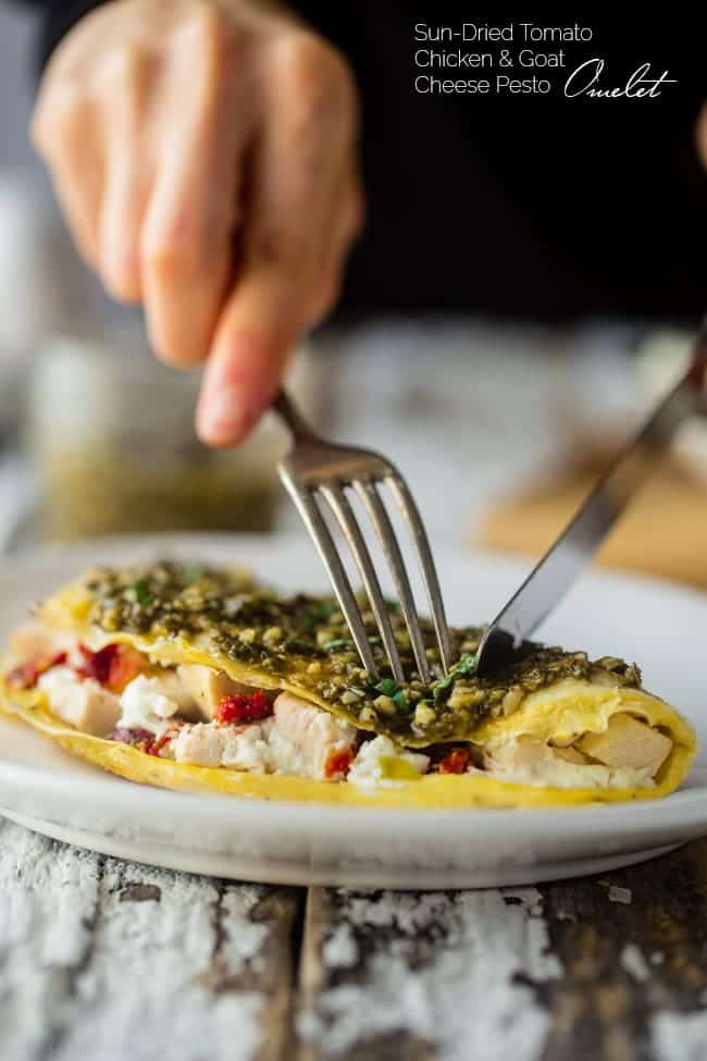 Pesto Chicken Egg White Omelette with Goat Cheese - This quick and easy, protein packed egg white omelette is mixed with chicken, creamy goat cheese and topped with pesto! It's a low carb and gluten free breakfast for busy mornings! | Foodfaithfitness.com | @FoodFaithFit