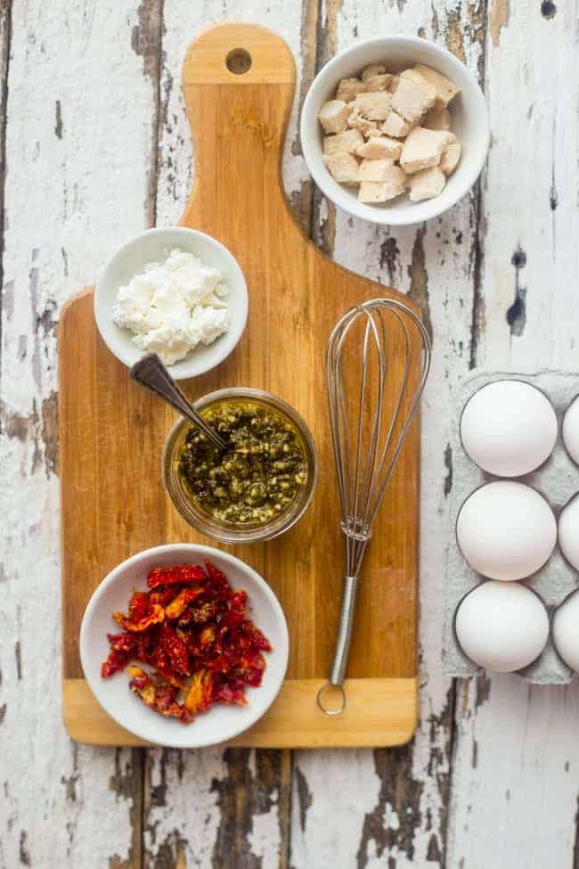 Pesto Chicken Egg White Omelette with Goat Cheese - This quick and easy, protein packed egg white omelette is mixed with chicken, creamy goat cheese and topped with pesto! It's a low carb and gluten free breakfast for busy mornings! | Foodfaithfitness.com | @FoodFaithFit