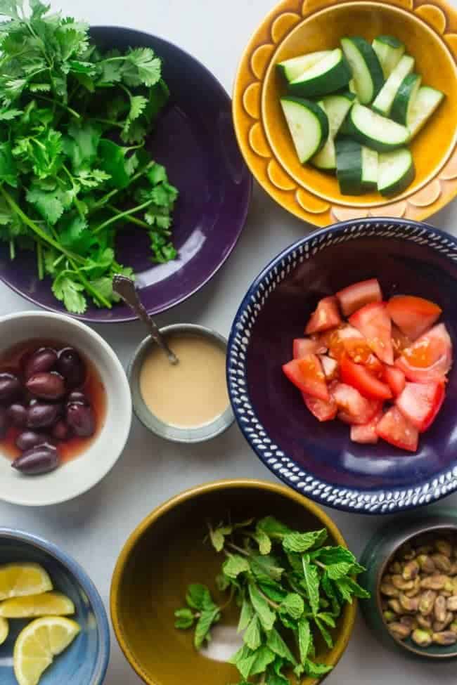 Paleo Grilled Moroccan Chicken Bowls - These grilled Moroccan chicken bowls are loaded with charred veggies, creamy tahini and spicy chicken! They're a quick and easy dinner that's paleo friendly and Whole30 compliant! | Foodfaithfitness.com | @FoodFaithFit
