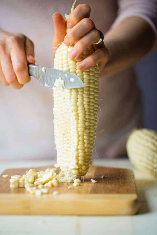 Vegan Fresh Corn and Mango Salad - This healthy salad has fresh corn, juicy, sweet mangos and tons of crispy, fresh vegetables! It's the perfect, quick and easy side dish for summer that is under 100 calories! | Foodfaithfitness.com | @FoodFaithFit