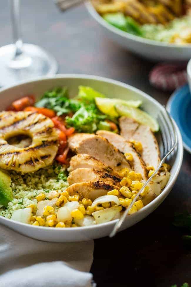Paleo Mexican Chicken Bowls with Pineapple Grilled Cauliflower Rice - These easy chicken bowls have grilled cauliflower rice and a spicy-sweet pineapple chili sauce! They're a healthy, gluten free dinner that's big on flavor! | Foodfaithfitness.com | @FoodFaithFit