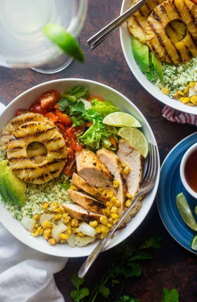 Paleo Mexican Chicken Bowls with Pineapple Grilled Cauliflower Rice - These easy chicken bowls have grilled cauliflower rice and a spicy-sweet pineapple chili sauce! They're a healthy, gluten free dinner that's big on flavor! | Foodfaithfitness.com | @FoodFaithFit