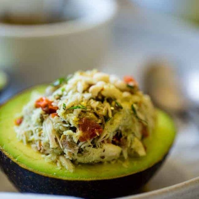 Mediterranean Healthy Tuna Salad Stuffed Avocados - This tuna salad has a Mediterranean twist and is served in an avocado! It has no mayo and is an easy, gluten free and low carb meal with only 6 ingredients! | Foodfaithfitness.com | @FoodFaithFit