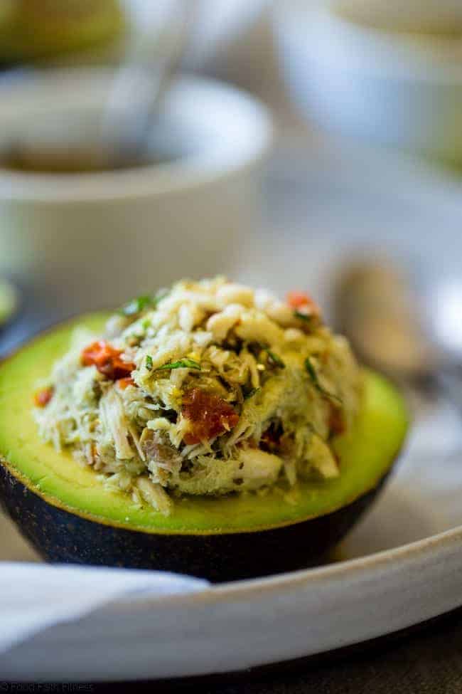 Mediterranean Healthy Tuna Salad Stuffed Avocados - This tuna salad has a Mediterranean twist and is served in an avocado! It has no mayo and is an easy, gluten free and low carb meal with only 6 ingredients! | Foodfaithfitness.com | @FoodFaithFit