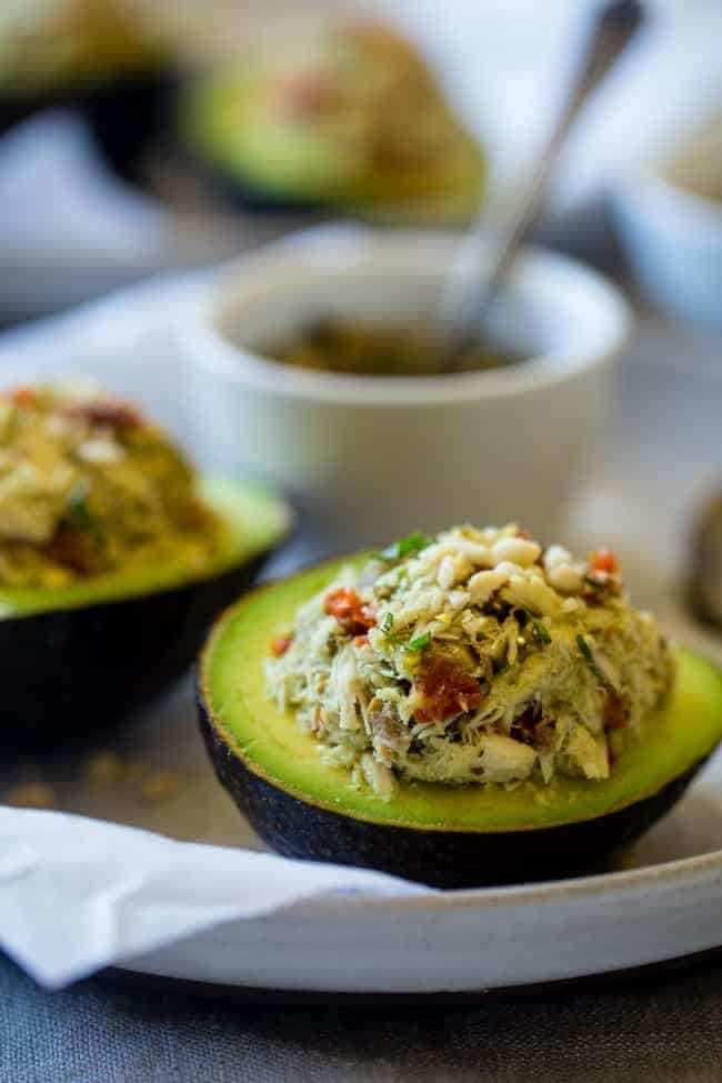 Mediterranean Healthy Tuna Salad Stuffed Avocados - This tuna salad has a Mediterranean twist and is served in an avocado! It has no mayo and is an easy, gluten free and low carb meal with only 6 ingredients! | Foodfaithfitness.com | @FoodFaithFit