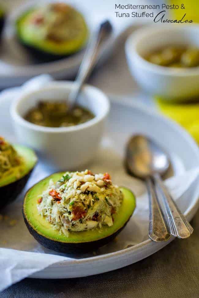 Mediterranean Healthy Tuna Salad Stuffed Avocados - This tuna salad has a Mediterranean twist and is served in an avocado! It has no mayo and is an easy, gluten free and low carb meal with only 6 ingredients! | Foodfaithfitness.com | @FoodFaithFit