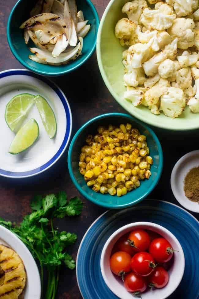 Paleo Mexican Chicken Bowls with Pineapple Grilled Cauliflower Rice - These easy chicken bowls have grilled cauliflower rice and a spicy-sweet pineapple chili sauce! They're a healthy, gluten free dinner that's big on flavor! | Foodfaithfitness.com | @FoodFaithFit