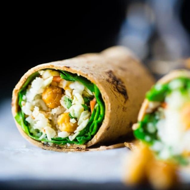 Vegan "Honey" Garlic Chickpea and Cauliflower Rice Wrap - This healthy wrap has an Asian flair with crunchy "honey" garlic roasted chickpeas and cauliflower rice! It's a quick and easy, portable and vegan friendly meal that's perfect for lunchboxes! | Foodfaithfitness.com | @FoodFaithFit