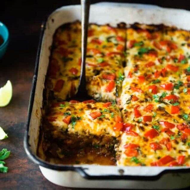 Mexican Zucchini Lasagna - This lasagna has all the cheesy, saucy taste but without the carbs and calories! It's a healthy, gluten free and protein-packed crowd-pleasing dinner that's only 280 calories! Make-ahead and freezer friendly too! | Foodfaithfitness.com | @FoodFaithFit