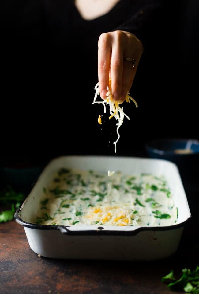 Mexican Zucchini Lasagna - This lasagna has all the cheesy, saucy taste but without the carbs and calories! It's a healthy, gluten free and protein-packed crowd-pleasing dinner that's only 280 calories! Make-ahead and freezer friendly too! | Foodfaithfitness.com | @FoodFaithFit