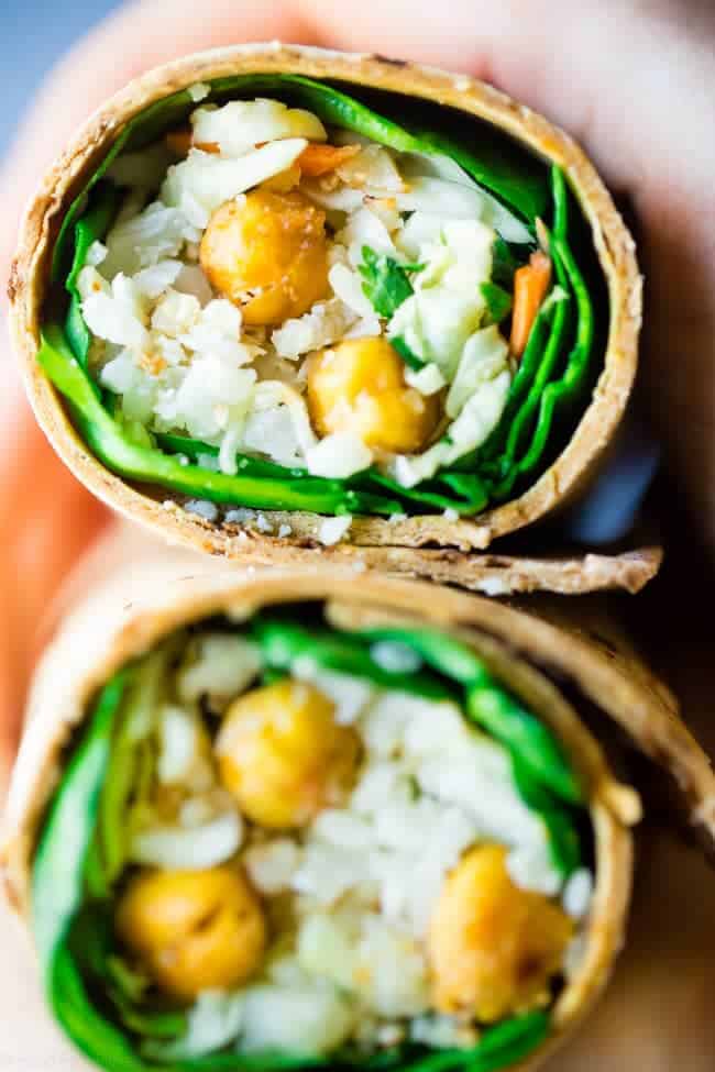 Vegan "Honey" Garlic Chickpea and Cauliflower Rice Wrap - This healthy wrap has an Asian flair with crunchy "honey" garlic roasted chickpeas and cauliflower rice! It's a quick and easy, portable and vegan friendly meal that's perfect for lunchboxes! Gluten free option included! | Foodfaithfitness.com | @FoodFaithFit